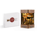 Magic Book Nook Kit packaging with finished miniature magic bookstore model and LED light display