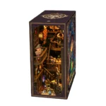 Illuminated right-angle view of the Alchemy Master book nook, featuring miniature wizards, potion bottles, curved wooden balconies, shelves, stairs and detailed magical workshop decor.