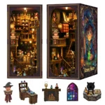 Multi-view display of the Alchemy Master book nook, featuring illuminated magical interiors, wizard figures, potion shelves, a fireplace, stained-glass window, cauldron and miniature workshop furniture.