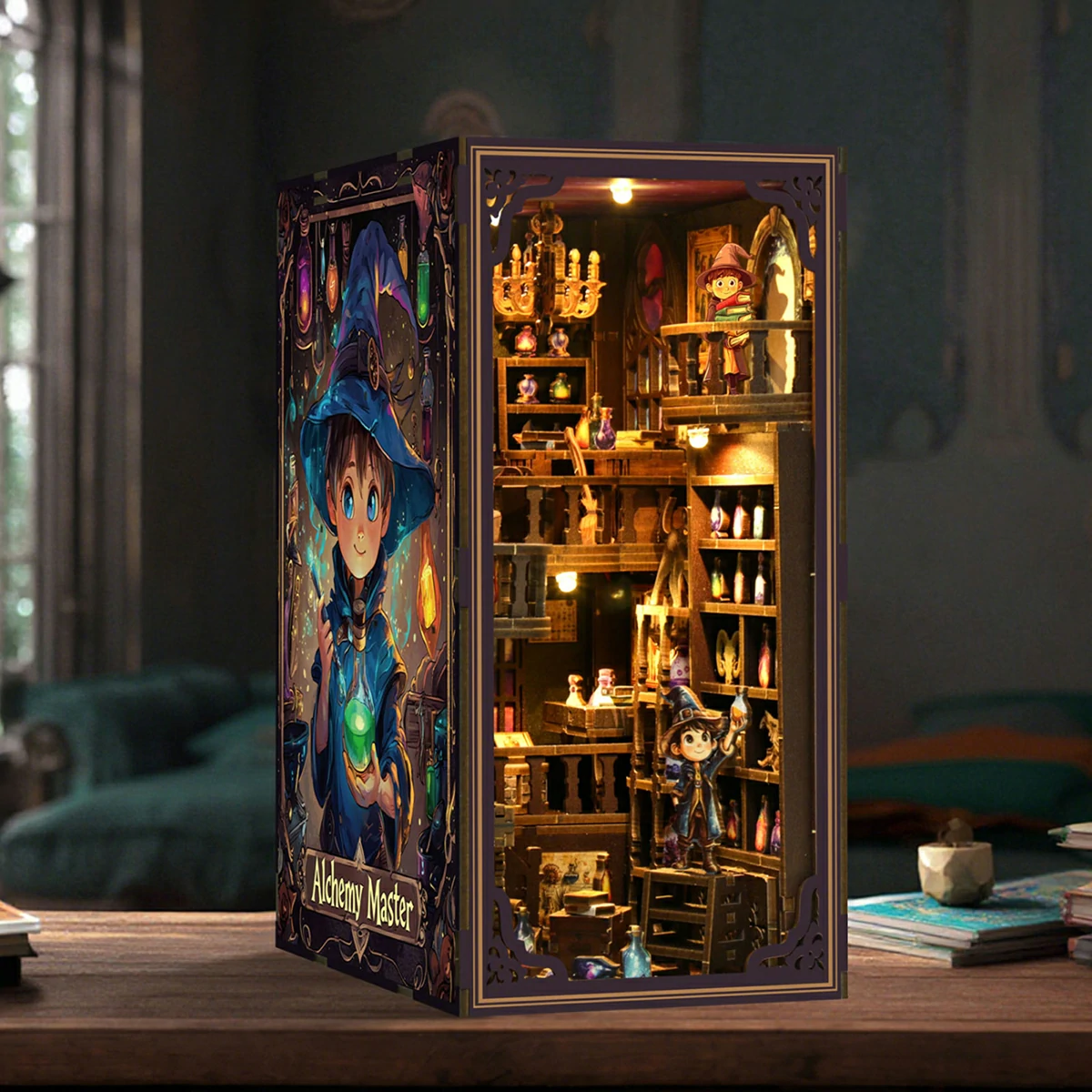 alchemy-master-book-nook-illuminated-lifestyle-display Illuminated Alchemy Master book nook displayed on a table, featuring miniature wizards, potion bottles, wooden balconies, shelves, chandeliers and detailed magical workshop decor.