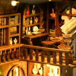Secret World of the Forest Book Nook magical library detail featuring miniature bookshelves, potion bottles, open magic book and wooden balcony design.