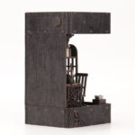 Side view of Detective Book Nook DIY kit featuring a miniature detective office, wooden bookshelf insert and realistic handcrafted details