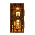 Illuminated front view of the Philosophical Classics Library book nook, featuring a chandelier, classical busts, display cases, carved columns, railings and a grand museum-style interior.