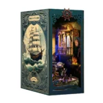 Underwater World Book Nook open book design featuring a vintage sailing ship cover, underwater ruins, coral details and illuminated miniature scenery.