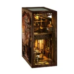 Serenity Coffee House book nook angled final display, showcasing a miniature coffee house scene with warm LED lighting, wooden textures, detailed architecture and handcrafted bookshelf decoration.
