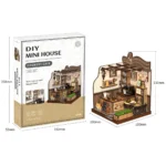Country Cafe DIY miniature kit shown with its packaging and completed model, measuring 100 × 100 × 130 mm.
